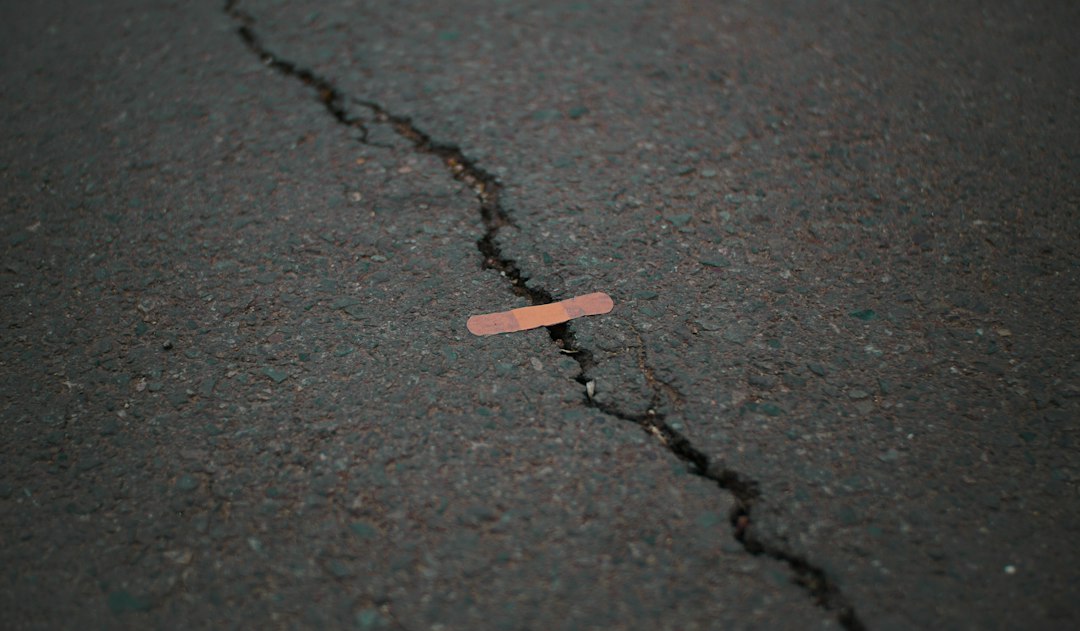 Close-up view of a cracked hard outdoor surface