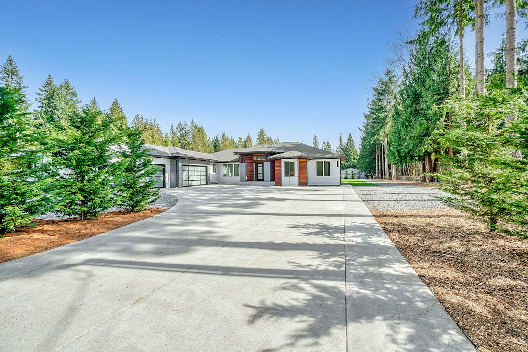 Residential home exterior with a concrete driveway
